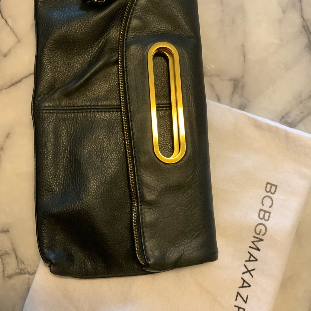 BCBGMaxAzria Black foldable Clutch ,tassel charm with Gold Details. - Picture 9 of 16